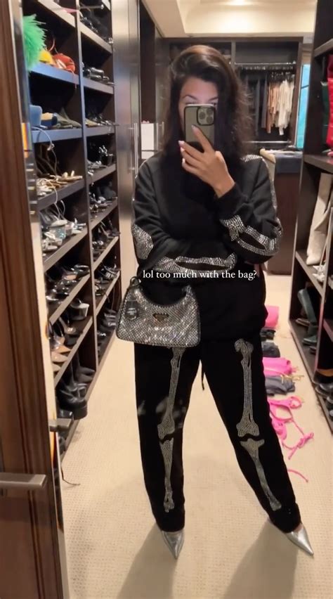 Kourtney Kardashian poses with .5K Prada bag & shares rare 